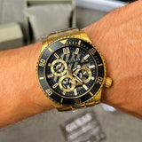 Guess Axle Multifunction Black Dial Gold Steel Strap Watch For Men - GW0488G2